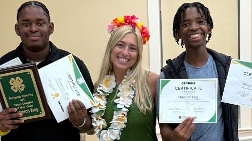 Fayette County 4-H Agent with 4-H’ers at End of the Year Awards Banquet